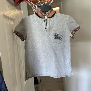 This a authentic Burberry polo style shirt size 8silver and tan.